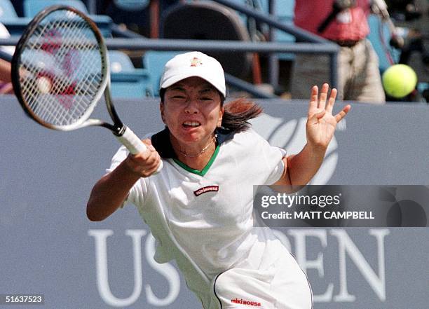 Japan's Yuka Yoshida chases down a return to Switzerland's Patty Schnyder 31 August at the US Open in Flushing Meadows. Yoshida lost in straight...