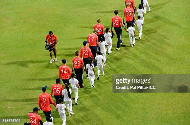 Mumbai, INDIA Team England walk to the middle for the national anthem during the ICC World Twenty20 India 2016 match between South Africa and England...