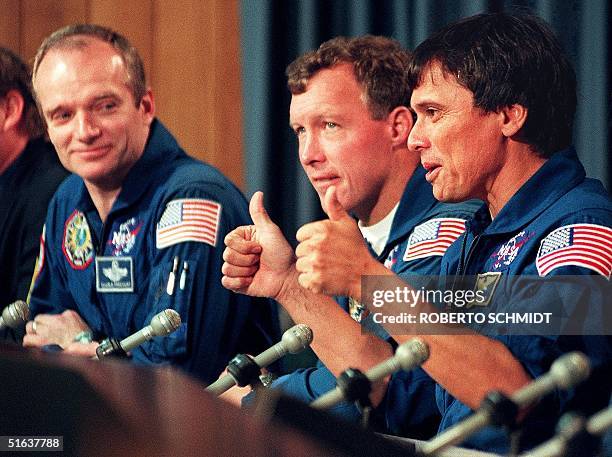 Costa Rican-born US astronaut Franklin Chang-Diaz gives a thumbs up to journalists as he answers a question about the health of Australian-born US...