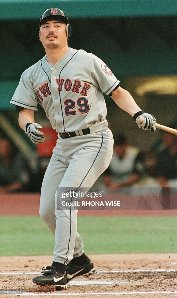 New York Mets pitcher Masato Yoshii swings through