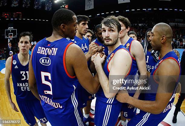 Players of Anadolu Efes Istanbul celebrate victory during the 2015-2016 Turkish Airlines Euroleague Basketball Top 16 Round 11 game between Anadolu...