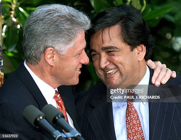 President Bill Clinton hugs Secretary of Energy nominee Bill Richardson during an 18 June Rose Garden ceremony at the White House. Richardson will be...