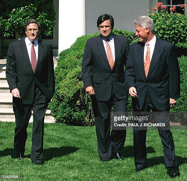 President Bill Clinton looks around as US Ambassador to the United Nations nominee Richard C. Holbrooke and US Secretary of Energy nominee Bill...