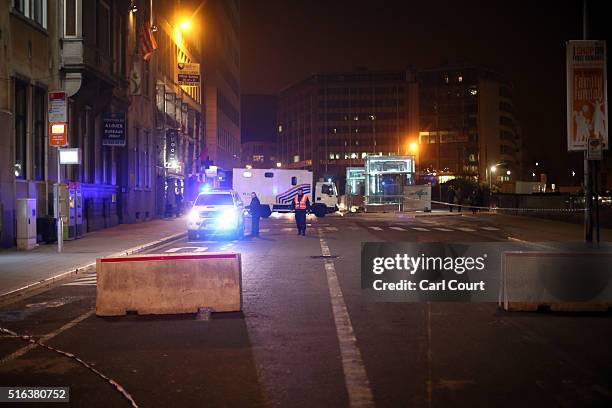 Concrete bollards are placed in the road as a security measure near the EU Council building during the EU summit on March 18, 2016 in Brussels,...