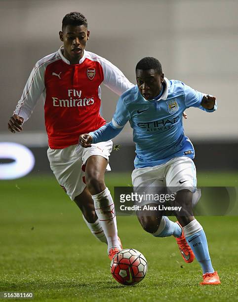 Aaron Nemane of Manchester City beats Jeff Reine-Adelaide of Arsenal during the FA Youth Cup Semi Final, First Leg match between Manchester City and...
