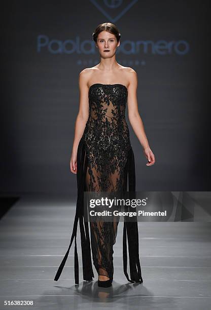 Model walks the runway wearing Paola Gamero 2016 collection during Toronto Fashion Week Fall 2016 at David Pecaut Square on March 18, 2016 in...