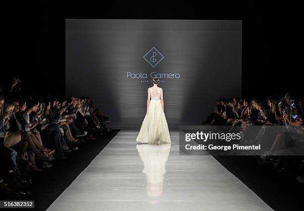 Model walks the runway wearing Paola Gamero 2016 collection during Toronto Fashion Week Fall 2016 at David Pecaut Square on March 18, 2016 in...