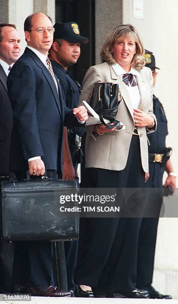 Linda Tripp departs the US Courthouse together with her lawyers Joe Murtha and Anthony J. Zaccagnini in Washington, D.C 09 July. Tripp is making her...