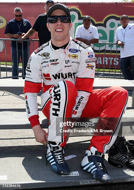 Race car driver Brad Keselowski reacts during his Walk of Fame Induction Ceremony at the Auto Club 400 NASCAR Sprint Cup Series Event Weekend at the...