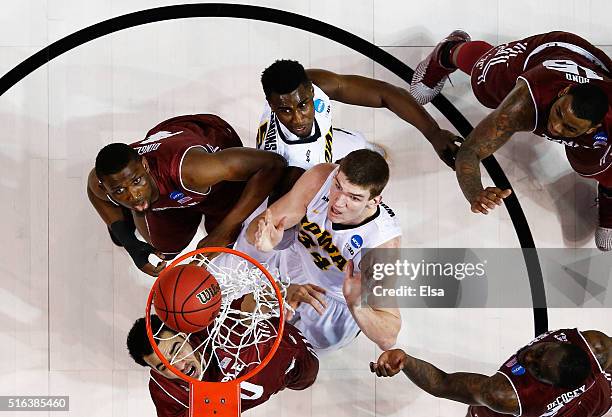 Adam Woodbury of the Iowa Hawkeyes shoots the game winning basket in overtime to defeat the Temple Owls during the first round of the 2016 NCAA Men's...