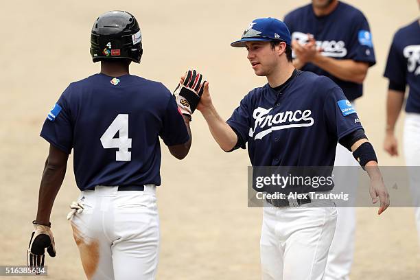 Frederic Hanvi celebrates with Norbert Congeries of Team France after scoring during Game 3 of the World Baseball Classic Qualifier against Team...