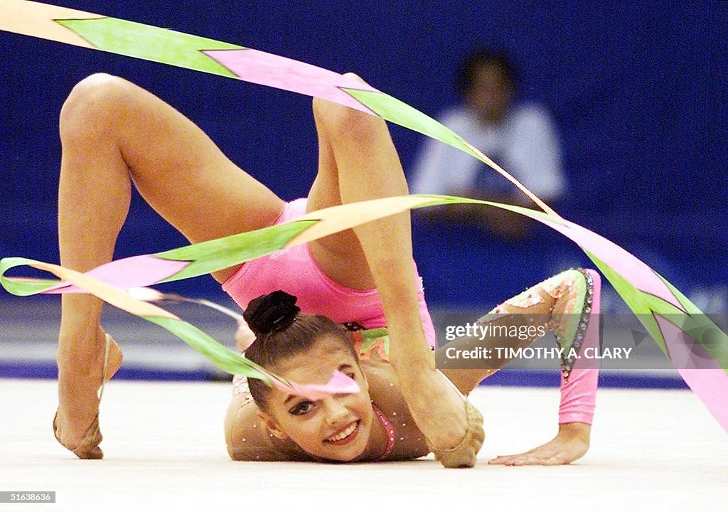 Alina Kabayeva of Russia performs part of her gold