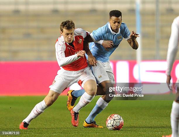 Krystian Bielik of Arsenal is challenged Lukas Nmecha of Man City during the match between Manchester City and Arsenal in the FA Youth Cup semi final...