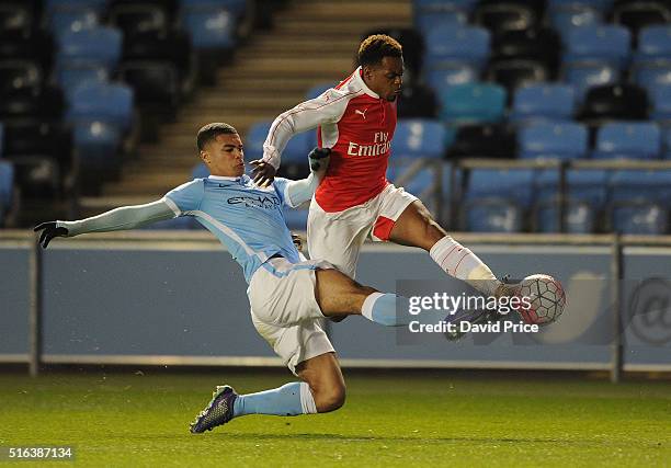 Tyrell Robinson of Arsenal takes on Cameron Humphreys-Grant of Man City during the match between Manchester City and Arsenal in the FA Youth Cup semi...