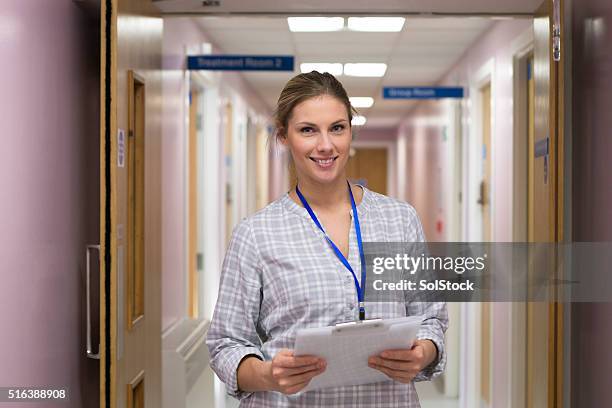 confident healthcare professional - family doctor stock pictures, royalty-free photos & images