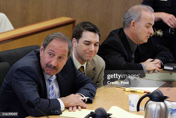 Scott Peterson and his defense attornies Mark Geragos and Pat Harris listens as prosecutor Rick Distaso makes closing arguments at the San Mateo...