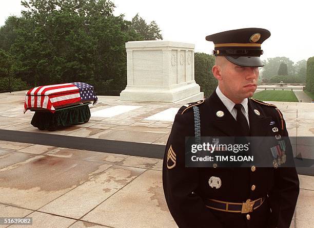 Army soldier keeps a vigil over the flag-draped casket that contains the remains of the Unknown from the Vietnam War, before ceremonies 14 May at the...