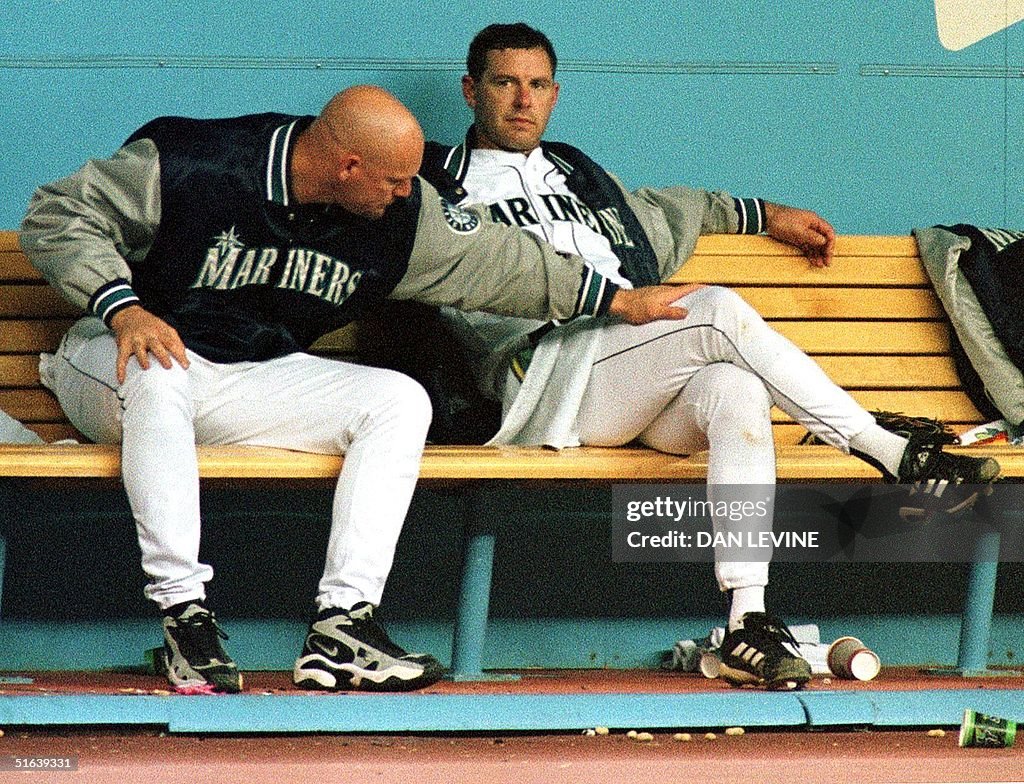 Seattle Mariners' Jay Buhner consoles Mariners' pitcher Jeff Fassero