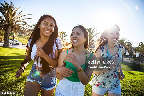women playing and relaxing at park - hot filipina women stockfoto's en -beelden