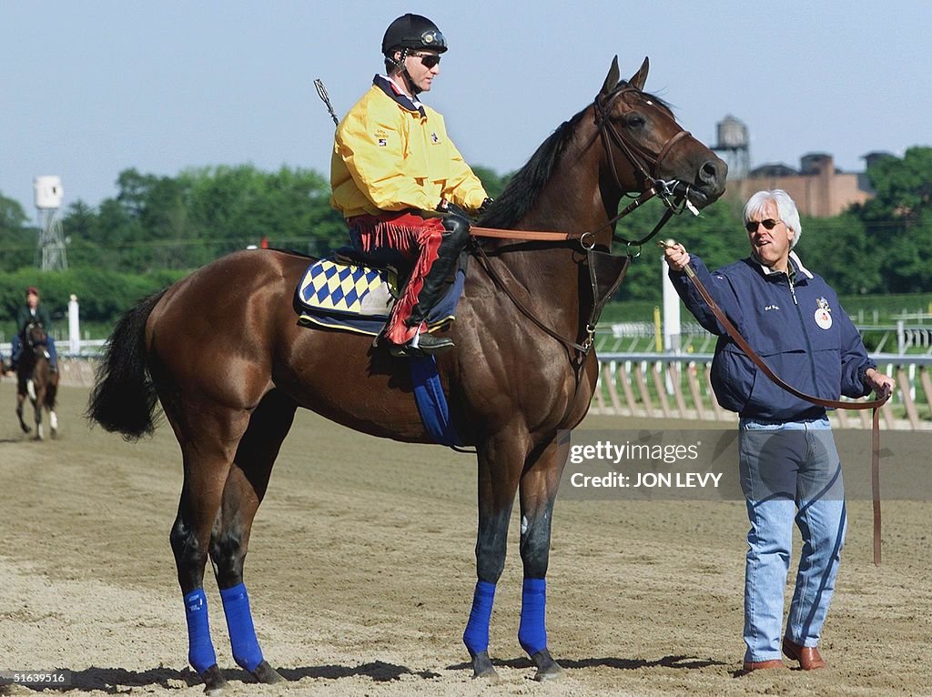 Trainer Bob Baffert (R) unleashes Kentucky Derby a