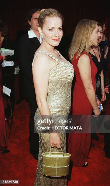 Former Best Actress Oscar winner Elisabeth Shue, who is pregnant, poses for photographers as she arrives for the 70th Annual Academy Awards 23 March...