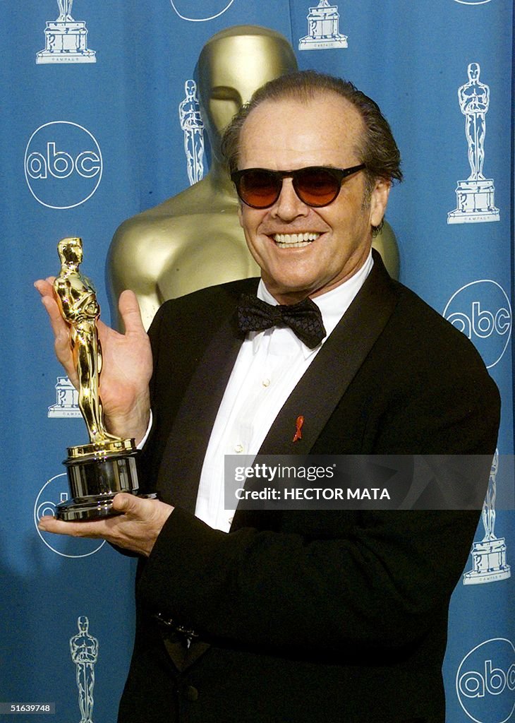 Jack Nicholson holds the Oscar he won for Best Act