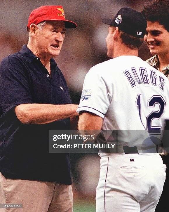 Boston Red Sox great Ted Williams (L) speaks with