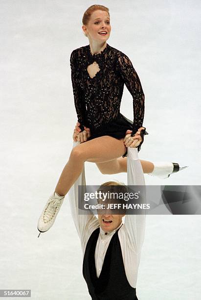 Jenni Meno and Todd Sand of the US perform a lift 31 March during the Pairs Short Program at World Figure Skating Championships at the Target Center...