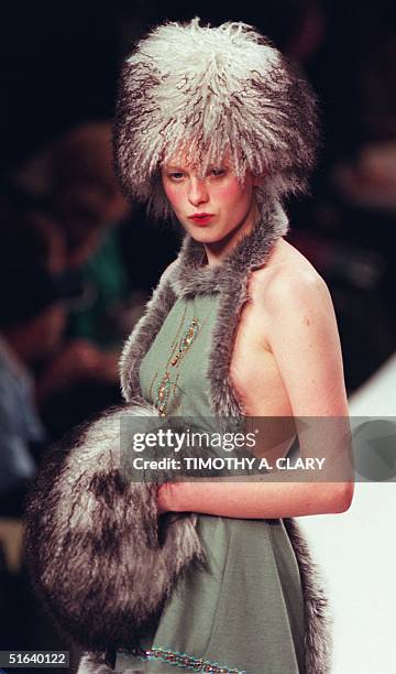 Model wears fur hat with a fur trimmed dress during the Anna Sui Fall-Winter collection show 01 April in New York. The collection is part of the 7th...