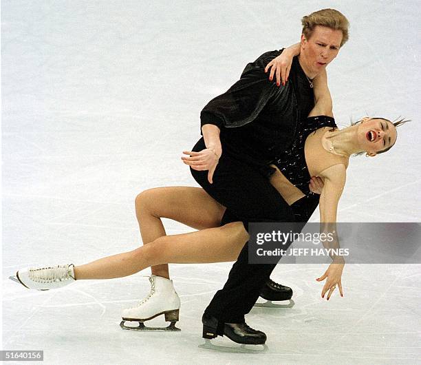 Oleg Ovsyannikov of Russia skates with partner Anjelika Krylova during the ice dancing original dance 02 April during the World Figure Skating...