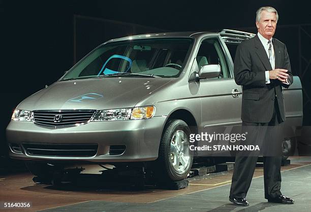 Dick Colliver, executive vice president of Honda, unveils an all-new 1999 minivan 08 April at the New York International Auto Show in New york, NY....
