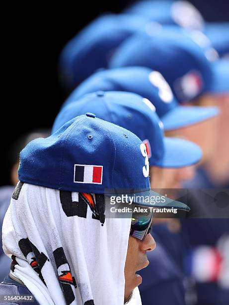 Members of Team France look on from the dugout during Game 3 of the World Baseball Classic Qualifier against Team Spain at Rod Carew Stadium on...