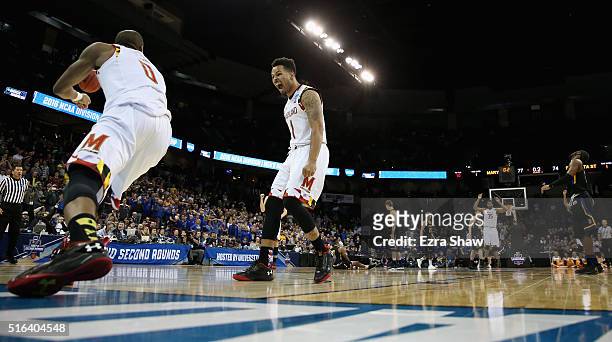 Jaylen Brantley of the Maryland Terrapins and Rasheed Sulaimon of the Maryland Terrapins celebrate a dunk in the closing seconds of the Terrapins...