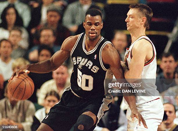 Seattle Supersonic Detlef Schrempf guards San Antonio Spur David Robinson during first quarter of their game in Seattle on April 17. Robinson has...