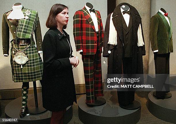 Kerry Taylor, head of costumes and textiles for Sotheby's, displays a series of outfits belonging to the Duke and Duchess of Windsor during a preview...
