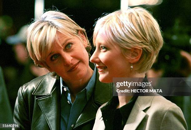 Television actress Ellen Degeneres arrives with her girlfriend-actress Anne Heche, who has a role in the movie "Sphere," to Mann's Village Theater in...