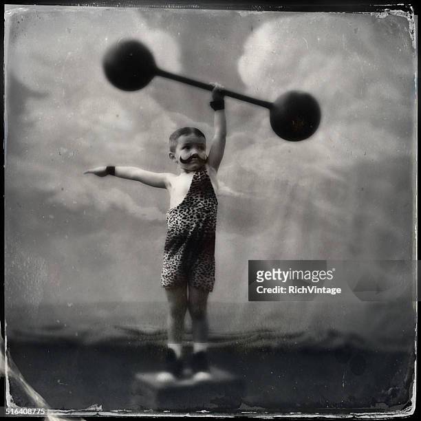 vintage muscle man - young kid and barbell bildbanksfoton och bilder