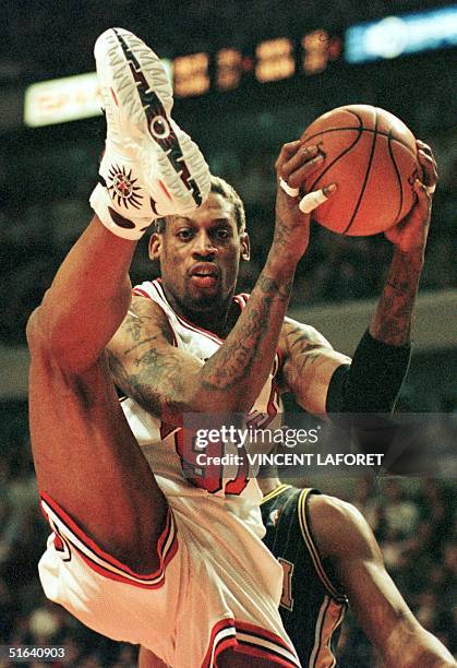 Chicago Bulls forward Dennis Rodman steals a rebound from Indiana Pacers forward Derrick McKey during the fourth quarter of their 17 February game at...