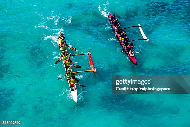 outrigger canoe racing at waikiki beach - outrigger stock pictures, royalty-free photos & images