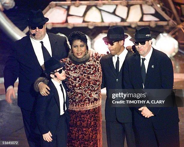 Aretha Franklin poses with the Blues Brothers John Goodman , J.Evan Bonifant , Joe Morton and Dan Aykroyd , after performing at the 40th Grammy...