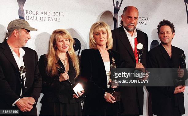 Members of the British rock group Fleetwood Mac John McVie, Stevie Nicks, Christine McVie, Mick Fleetwood and Lindsay Buckingham appear together...