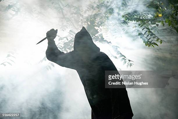 hooded monster with knife - killing stock-fotos und bilder