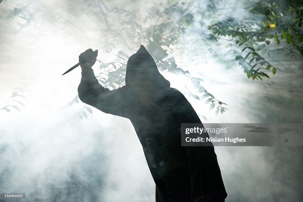 Hooded monster with knife