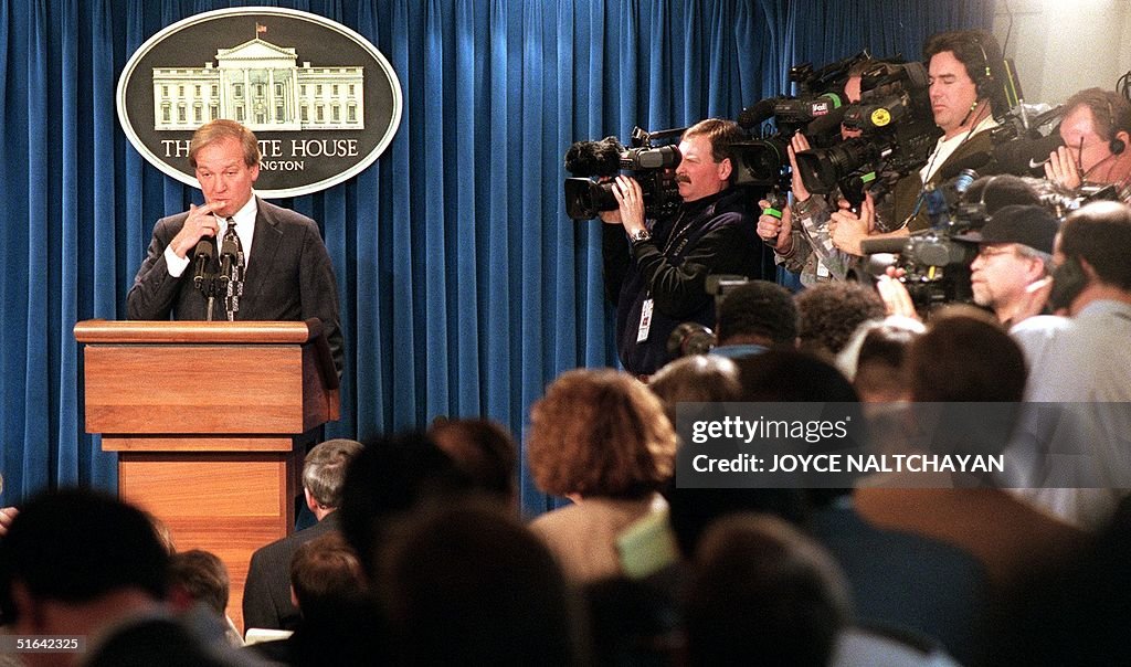 White House Press Secretary Mike McCurry, surround