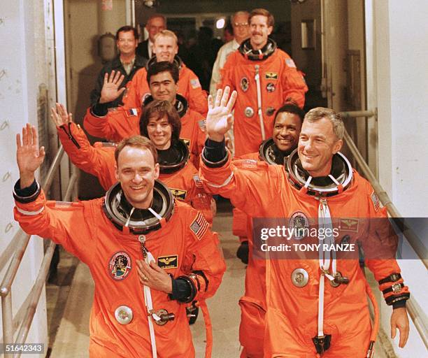 The flight crew of the Space Shuttle Endeavour Pilot Joe Edwards, Commmander Terrence Wilcutt, Payload Commander Bonnie Dunbar, Mission Specialst...