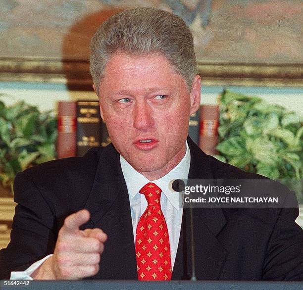 President Bill Clinton addresses reporters 26 January concerning an alleged affair with former White House intern Monica Lewinsky during an education...