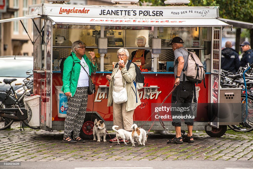 People buying and eating snacks in Copenhagen, Denmark