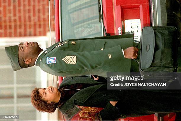 Army Command Sgt. Major Gene C. McKinney arrives at the courthouse with his wife Wilhelmina 03 February at Fort Belvoir, VA. If found guilty of...