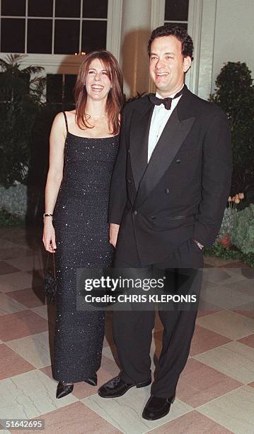 Actor Tom Hanks and Rita Wilson arrive at the White House 05 February for a state dinner in honor of British Prime Minister Tony Blair and his wife...