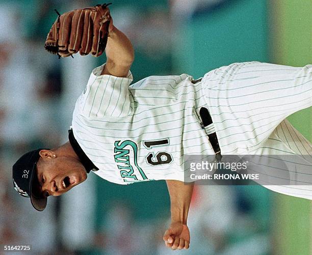 Livan Hernandez of the Florida Marlins celebrates after striking out Fred McGriff of the Atlanta Braves in the ninth inning 12 October during game...